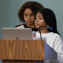 Two female speakers read from a podium during a community dialogue about Dr. King’s final speech, "I’ve Been to the Mountaintop." Two female speakers read from a podium during a community dialogue about Dr. King’s final speech, "I’ve Been to the Mountaintop."