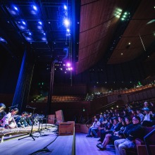 A student group performs in the Soka Performing Arts Center