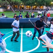 Students participate in human foosball during SUA's Welcome Back Community Event