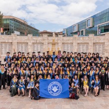 The Commemorative 2024 Class Photo in front of the fountain at Peace Lake