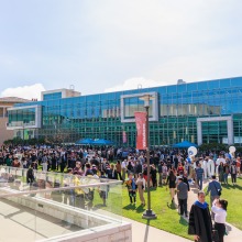 Graduates and their families and friends enjoy the commencement reception after the ceremony