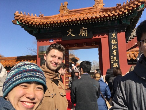 Selfie of two students in front of building in Harbin, China