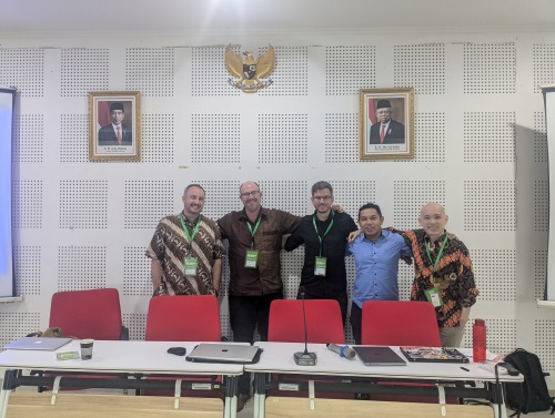 Shane Barter poses with scholars during the Association for Asian Studies in Asia annual conference 