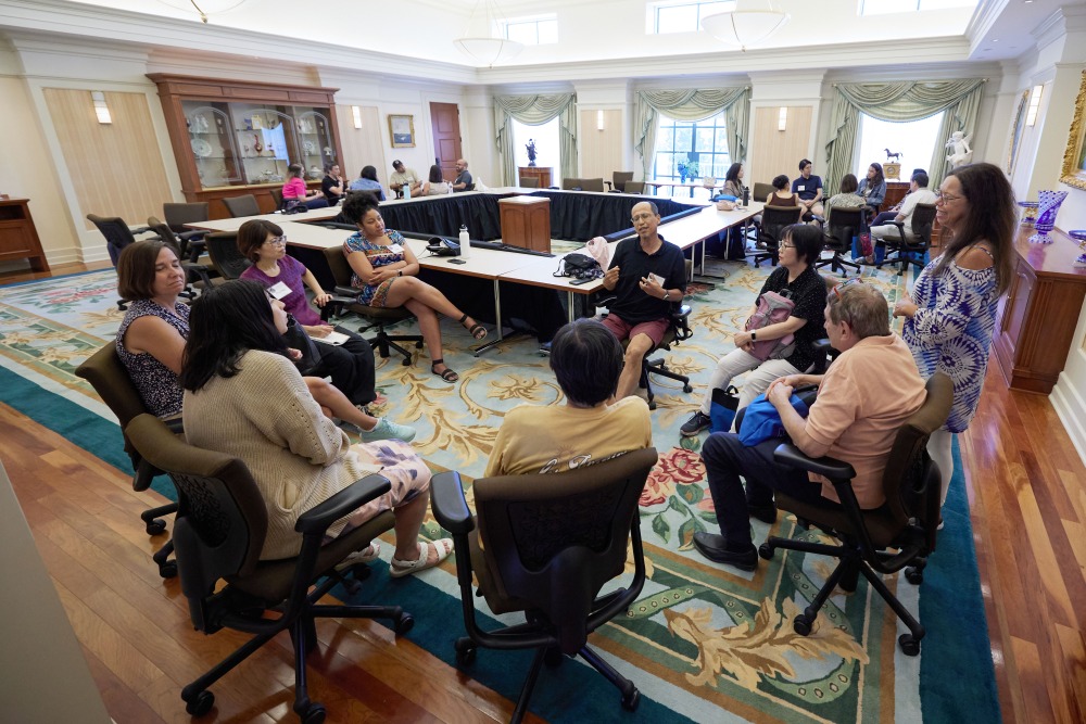 Alumni participate in group discussions in Founders Hall during the 30th anniversary of the Graduate School celebration