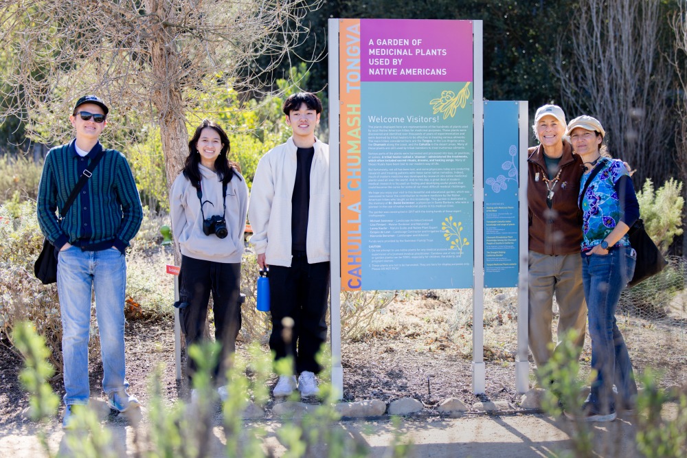 A small group of undergraduate students from the "Geo-storytelling Ballona" Learning Cluster pose at the Ballona Wetlands