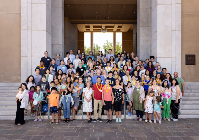 Alumni and their families pose for a commemorative photo of the 30th anniversary of the SUA Graduate School