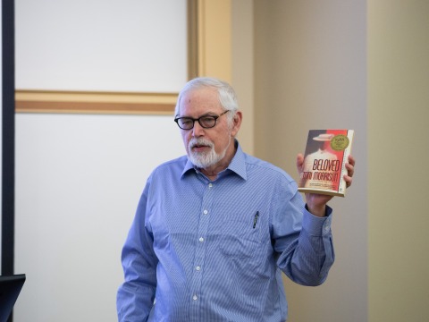 Professor Jonathan Arac holding Toni Morrison's Beloved