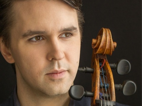 Andrew Janss holding cello