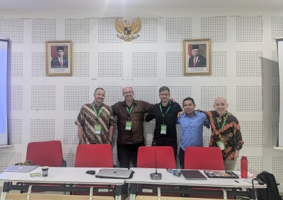 Shane Barter poses with scholars during the Association for Asian Studies in Asia annual conference 