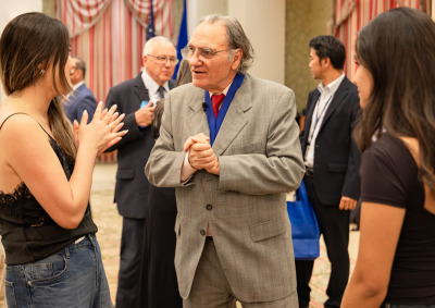 Carlos Alberto Torres talks with students after the award ceremony.