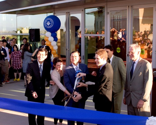 Dignitaries cut ceremonial ribbon