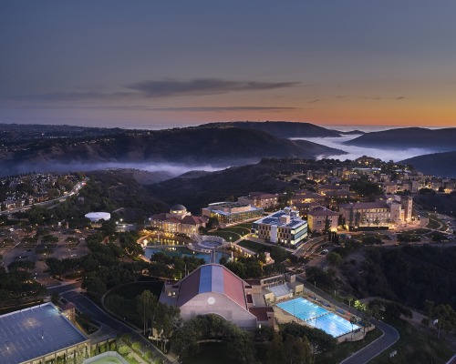 Aerial drone shot of SUA's campus during dusk