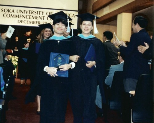 Graduates from the inaugural Graduate School commencement walk out during the processional with their diplomas in hand