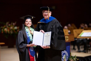 President Ed Feasel presents Subina Thapaliya with the Founders Award