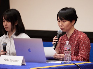 Yuki Iiyama speaks into the microphone